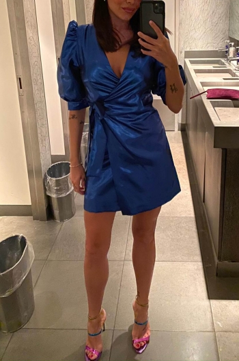 Alexandra taking a selfie in a blue dress