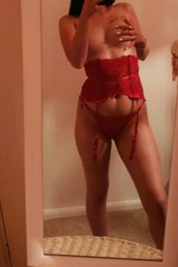 Jessica taking a mirror selfie in a set of red lingerie 